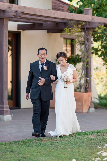 bride making her entrance at the winery ceremony