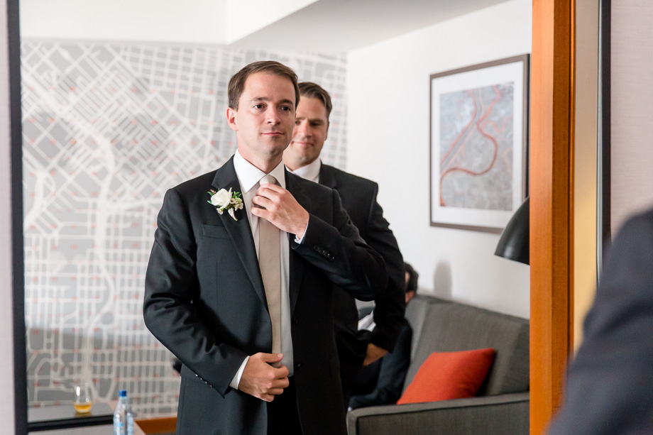 groom getting ready to see his bride