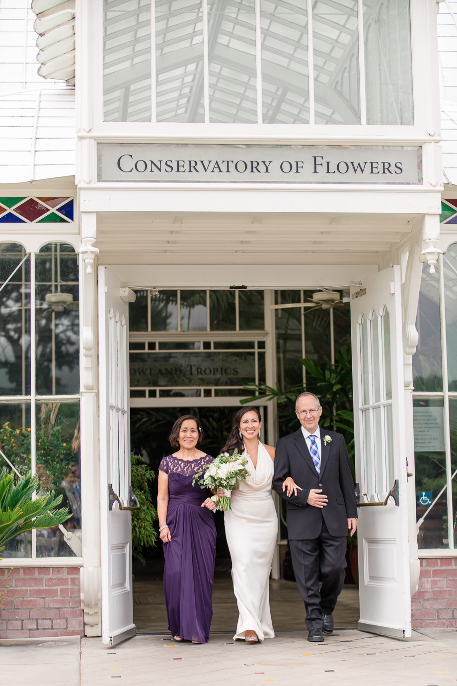 bride walking down the aisle at the conservatory of flowers