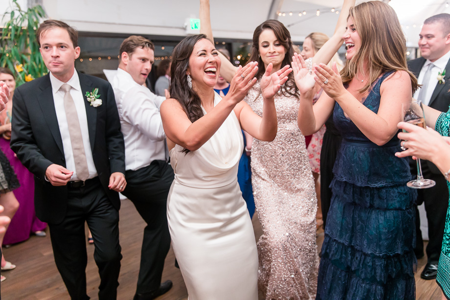 bride dancing with the bridesmaids