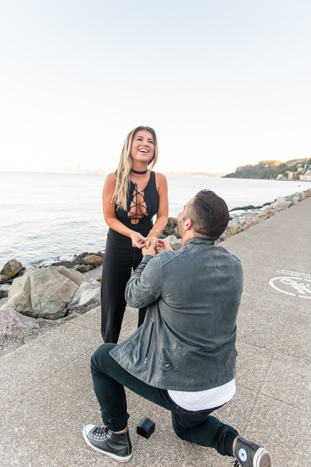 putting the engagement ring on her shaking hands