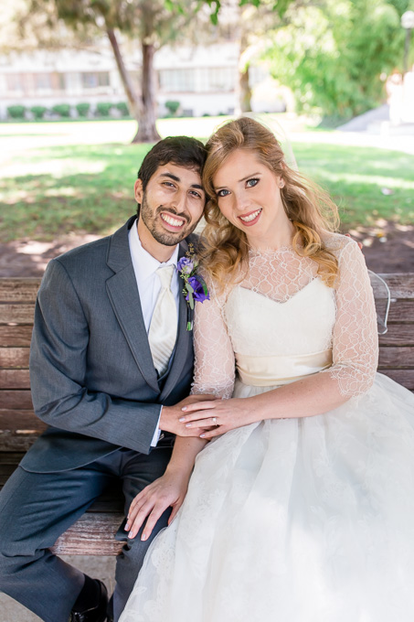 couple portrait at one of the benches on campus