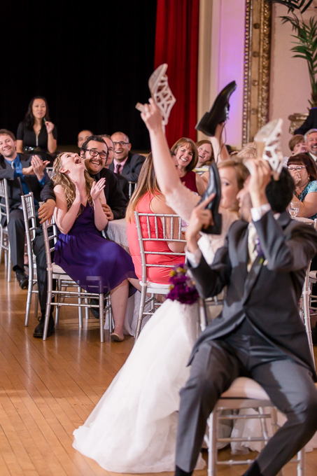 wedding guests laughing at bride and grooms shoe game answers