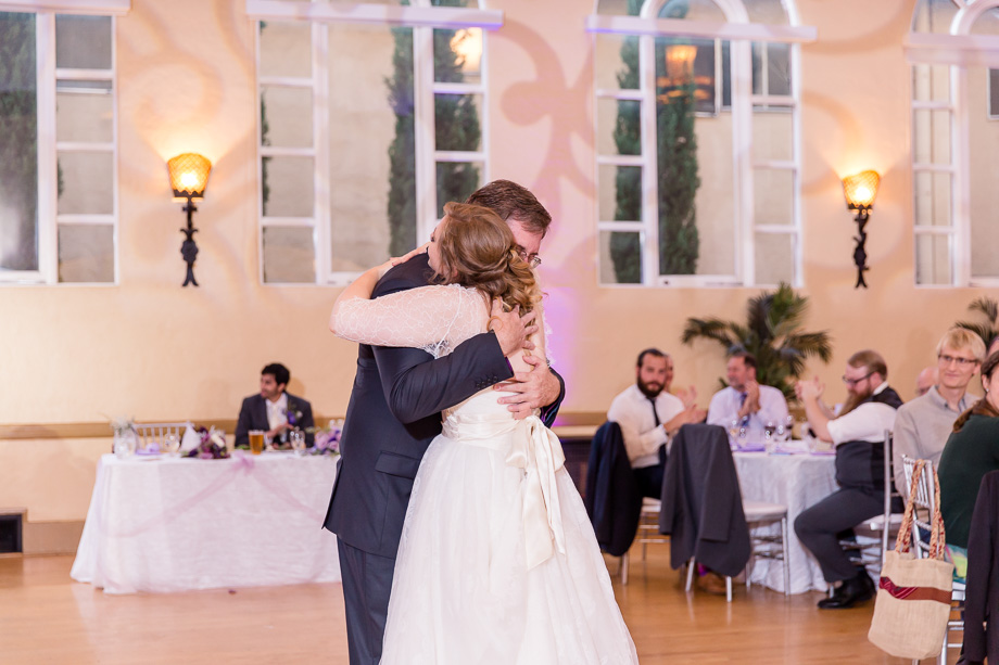 bride and father hug