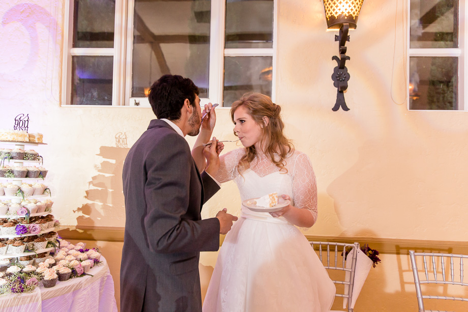 feeding each other wedding cake