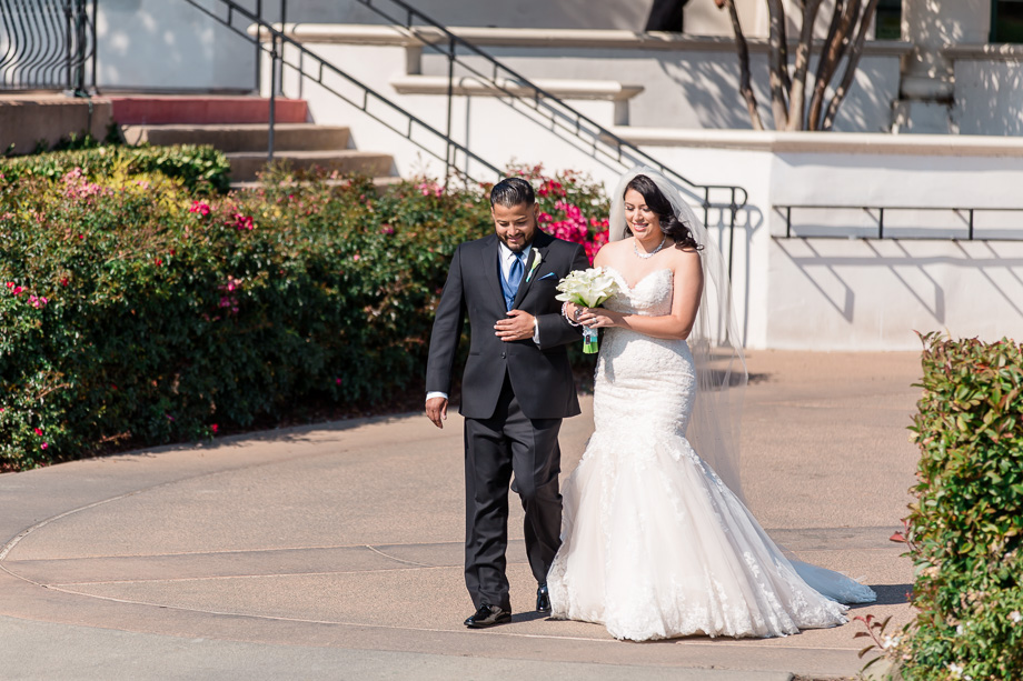 bride and brother walking down the aisle