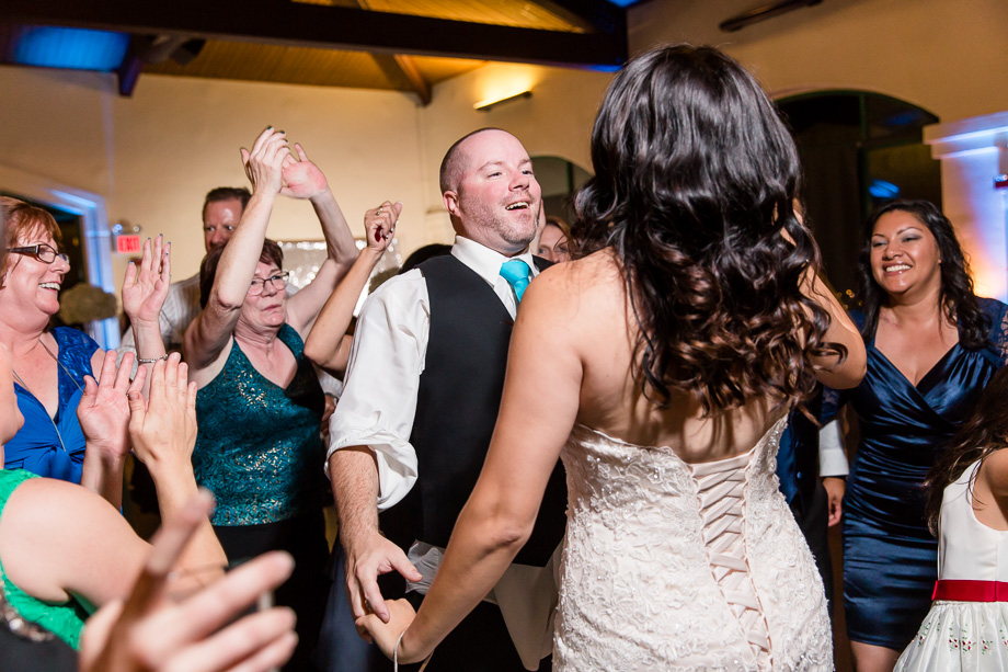 newlywed surrounded by their loved ones for their last dance of the night