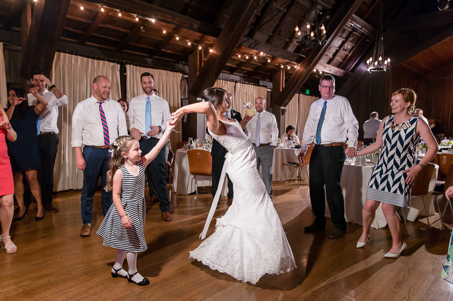 little wedding guest twirling the bride