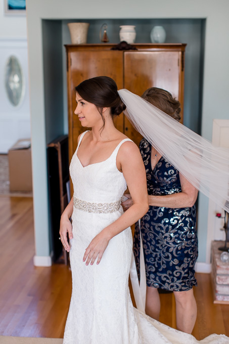 a simple lace gown with a sparkly bridal sash