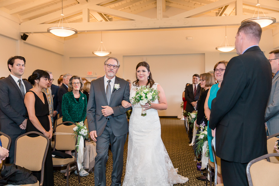 bride walking down the aisle with her father