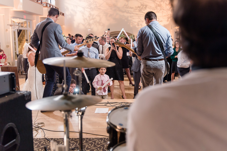 live band performaing with the groom on stage at the San Francisco wedding reception