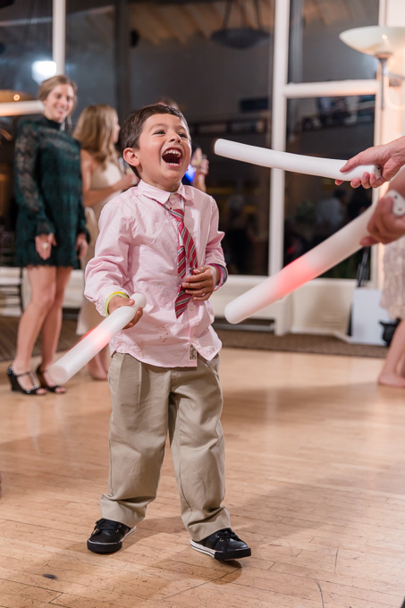 light saber fight at a wedding reception