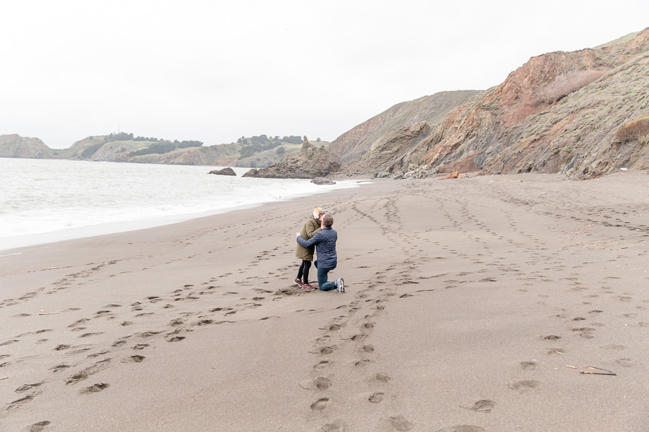 they are engaged here at the black sand beach