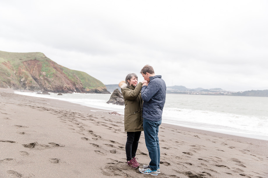 newly engaged couple enjoying their private time overlooking the Pacific ocean and the San Francisco Bay