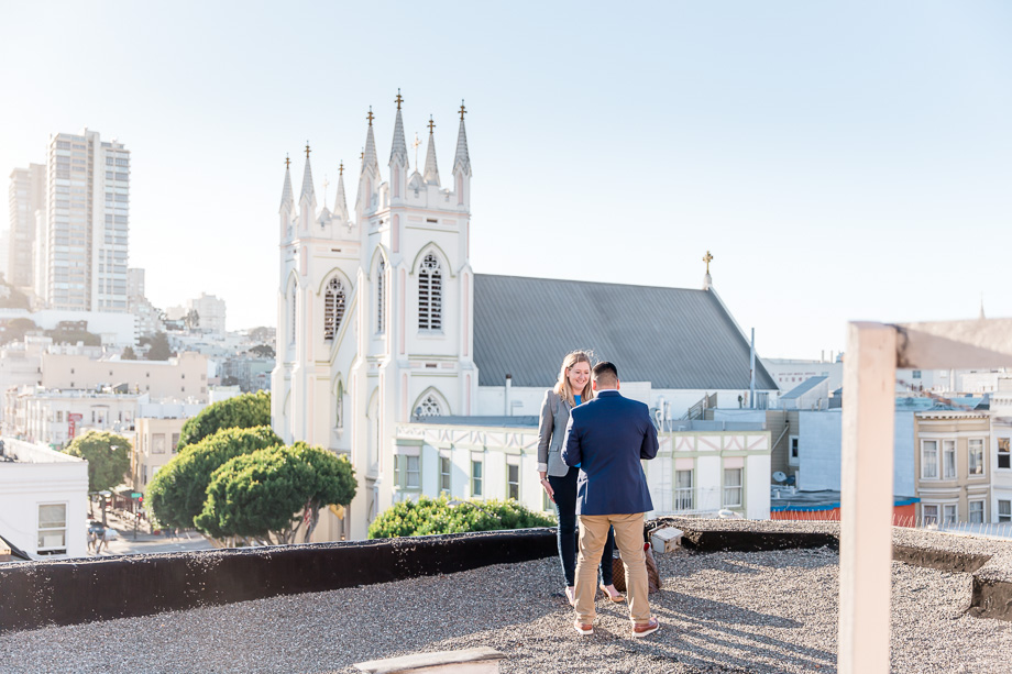 giving proposal speech on rooftop in front of church