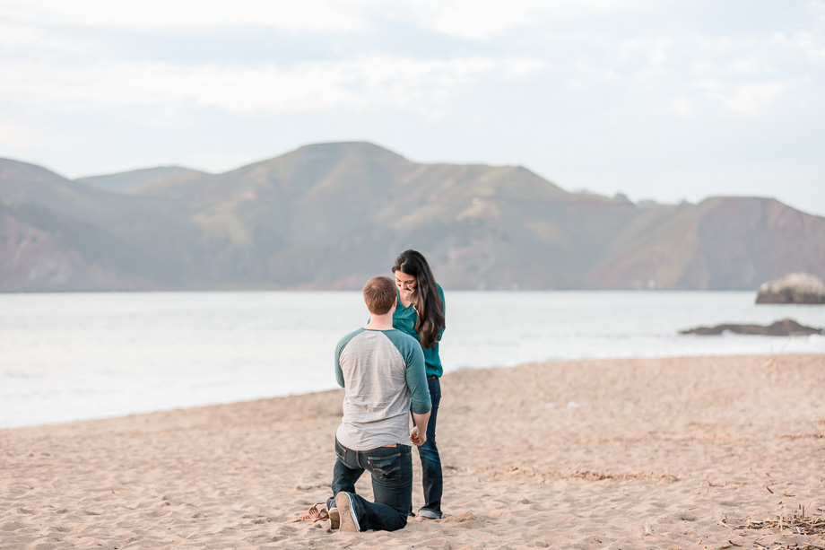 looking at the ring on sandy beach