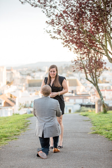 She couldnt believe what was happening under red blossoming trees