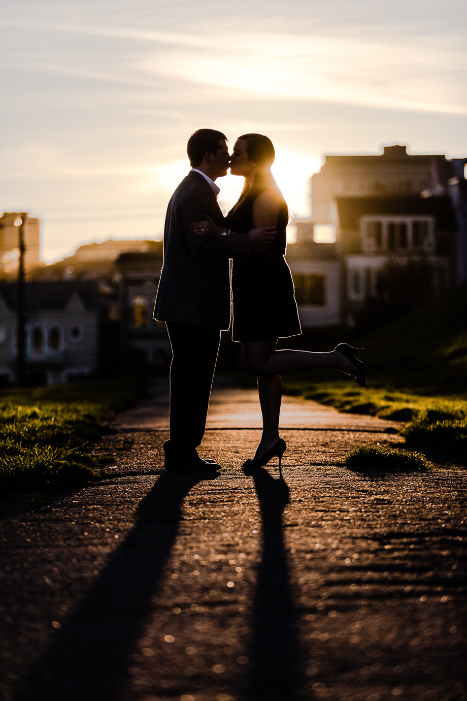 sharp contrast silhouette sunset kissing photo