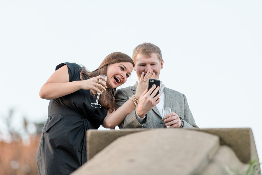 showing off her new ring and telling the news to family and friends