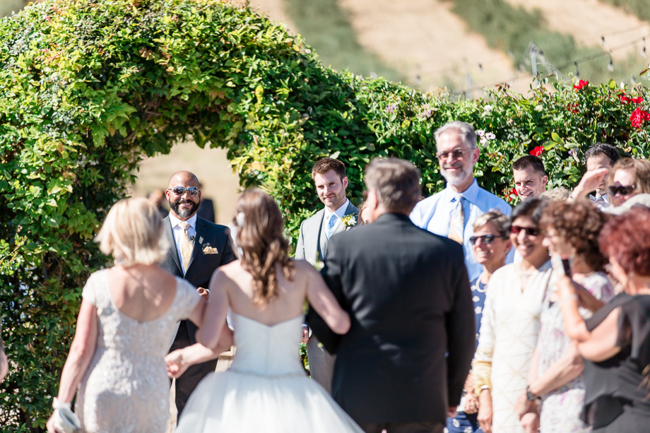 grooms sees his bride for the first time on their wedding day
