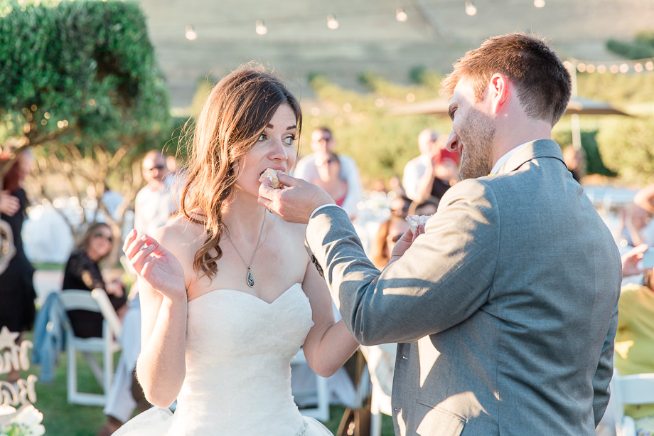 feeding each other wedding cake