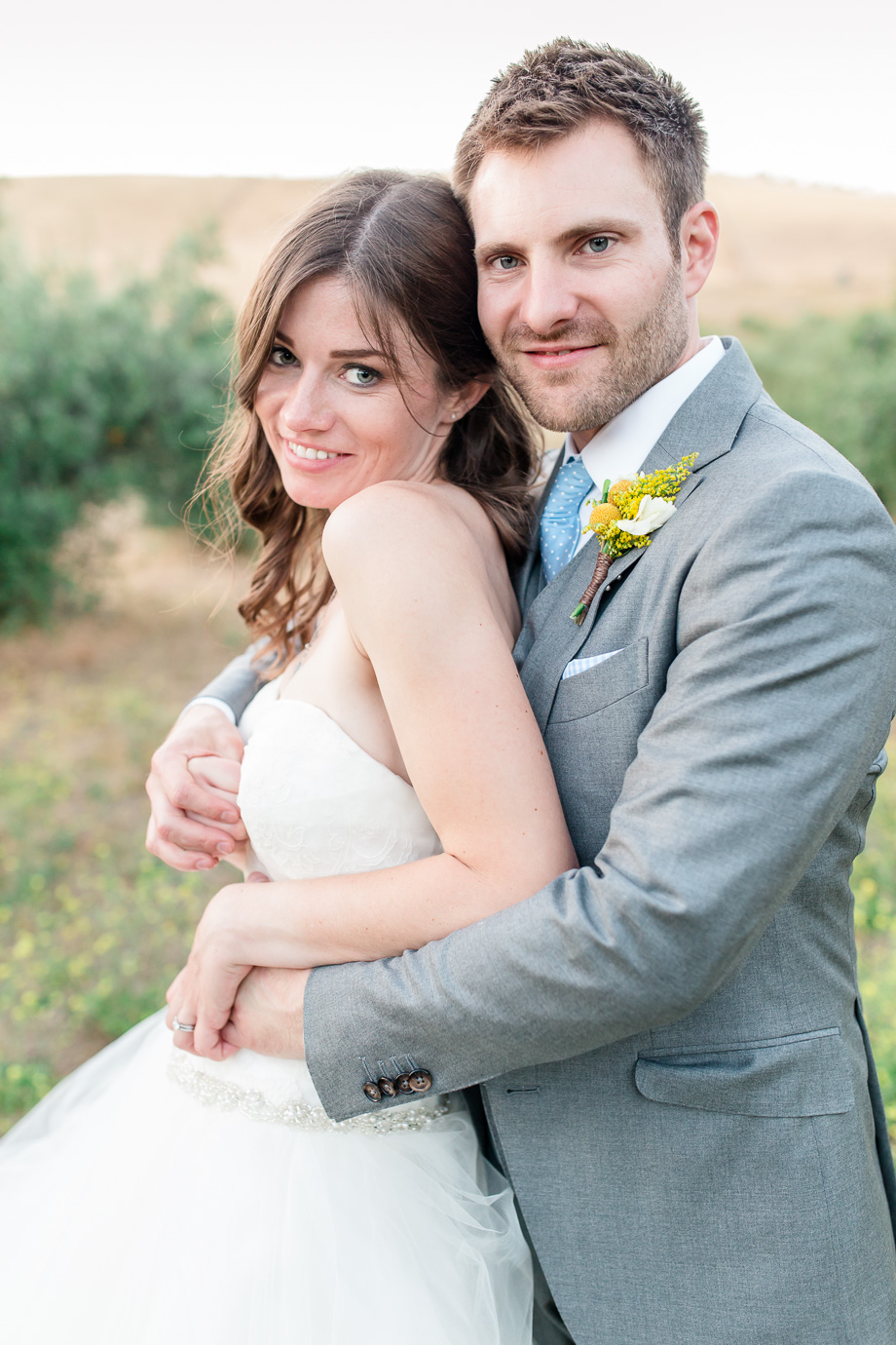 glowing bride and handsome groom portrait