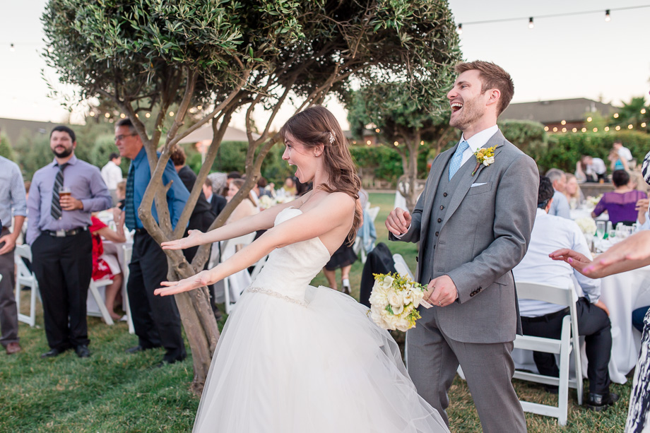 happy bride and groom at their outdoor reception - purple orchid resort