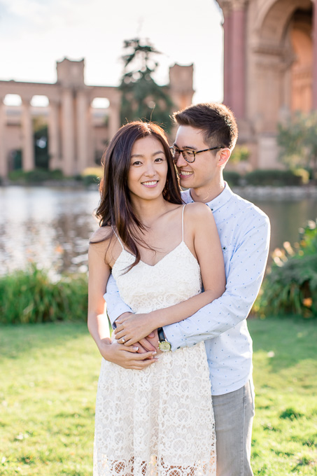 smiling engagement portrait at palace of fine arts