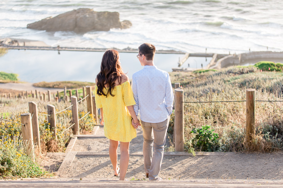 candid walking photo overlooking ocean coast