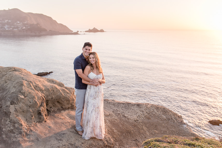 bay area romantic engagement photo at sunset overlooking the ocean up on a cliff